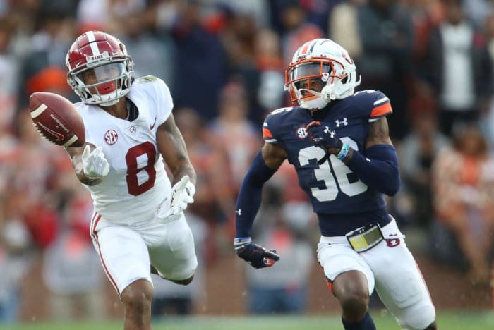 Nov 27, 2021; Auburn, Alabama, USA; Alabama Crimson Tide wide receiver John Metchie III (8) cannot catch a pass against Auburn Tigers Tigers defensive back Jaylin Simpson (36) during the first half at Jordan-Hare Stadium. Mandatory Credit: Gary Cosby Jr.-USA TODAY Sports